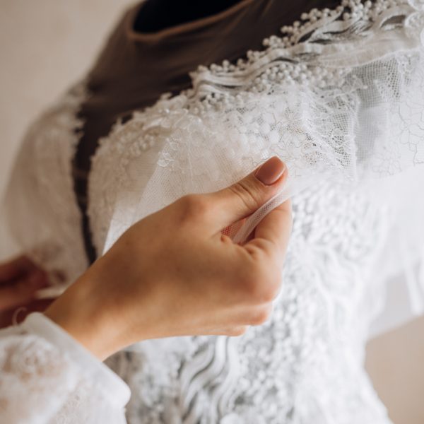 bride-adjusts-her-bridal-dress